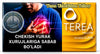 A rectangular product package or label for Terea Yellow, split into two main sections: the left side is black with a photo of a man clutching his chest and text in Uzbek, while the right side is bright yellow with the Terea logo and text. A circular 'IQOS Online Shop Dubai' mark appears on the left.